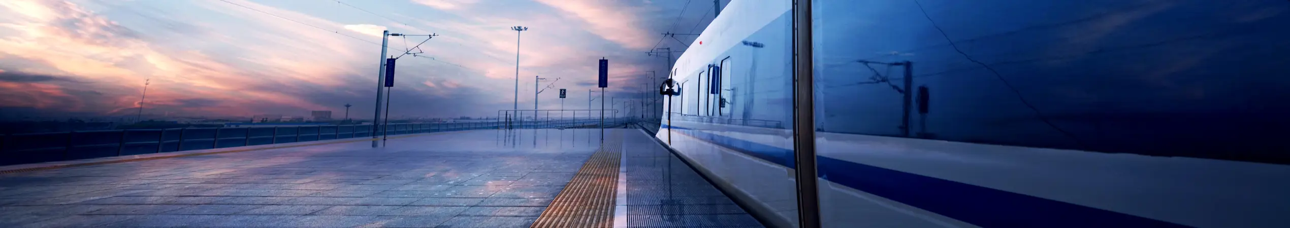train stop at railway station with sunset